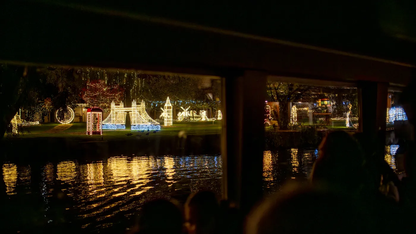 An illuminated sightseeing boat on the Vltava at night